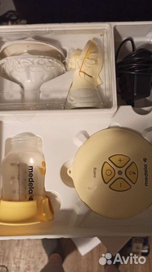 Молокоотсос medela электрический