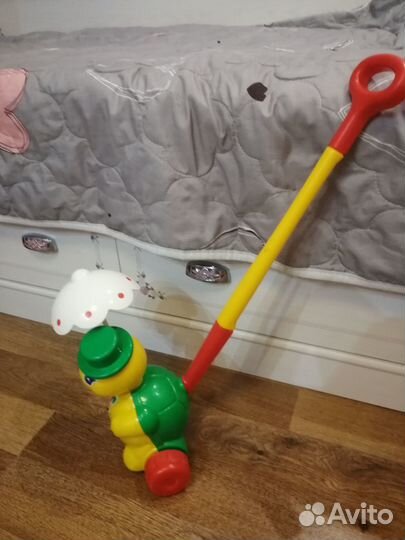 Игрушка каталка с ручкой