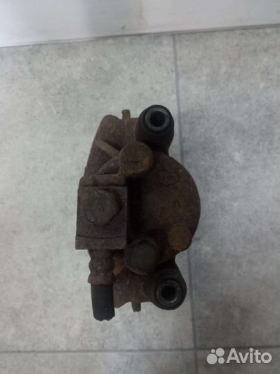 Суппорт тормозной передний левый Chrysler Voyager