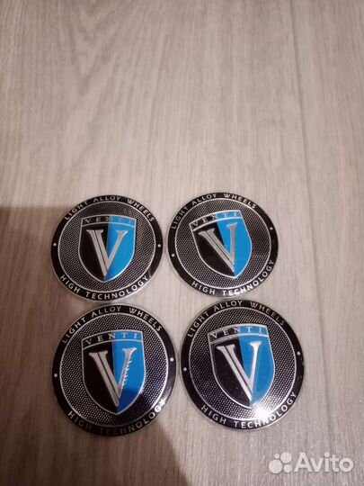 Наклейки на колпачки дисков