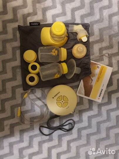 Молокоотсос medela электрический