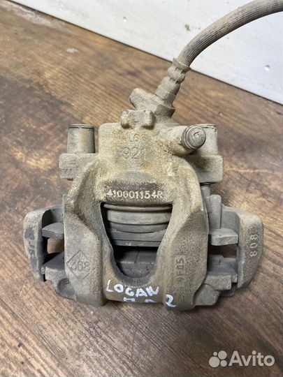 Суппорт тормозной передний левый Renault Logan 2