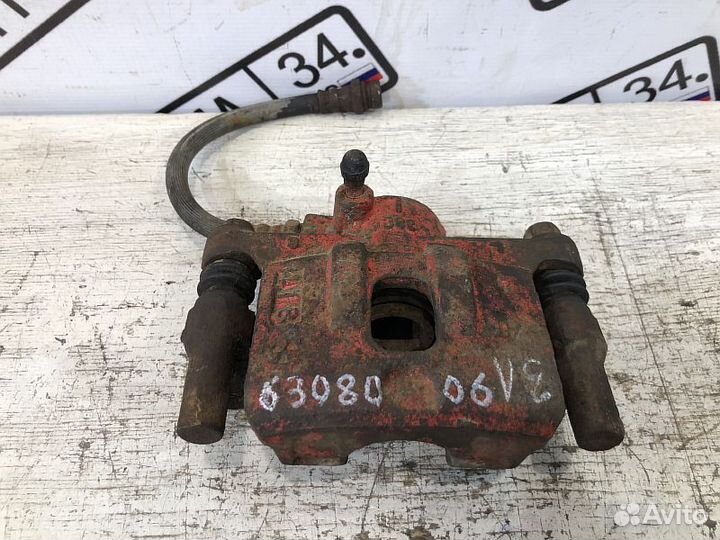 Суппорт тормозной задний Mitsubishi Lancer 9