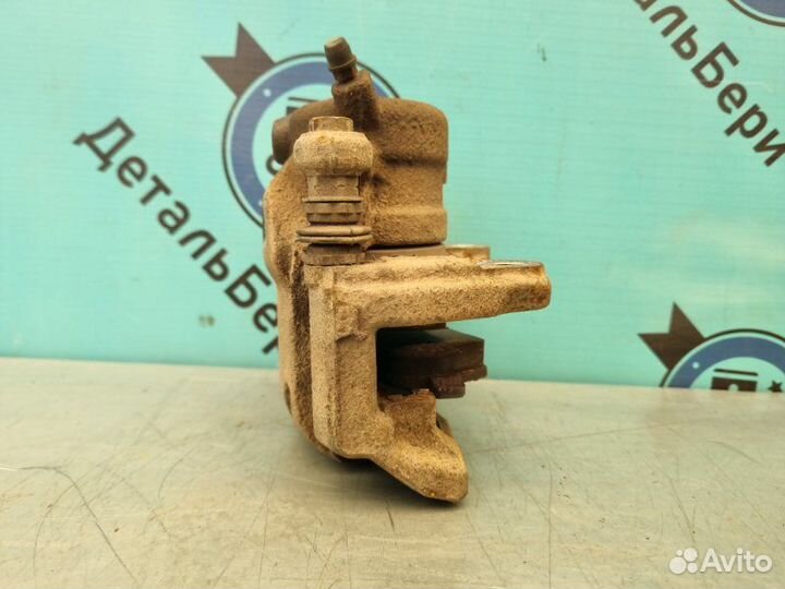 Суппорт тормозной передний левый Nissan Almera G15