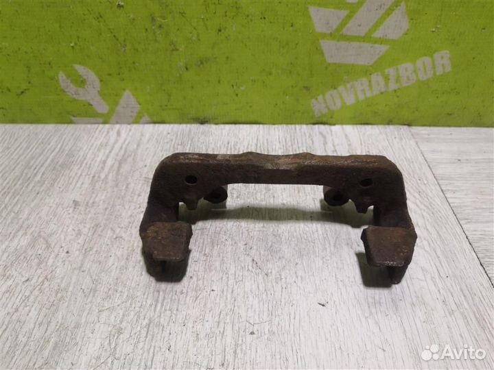 Скоба суппорта переднего Киа Сепия Шума 96-01