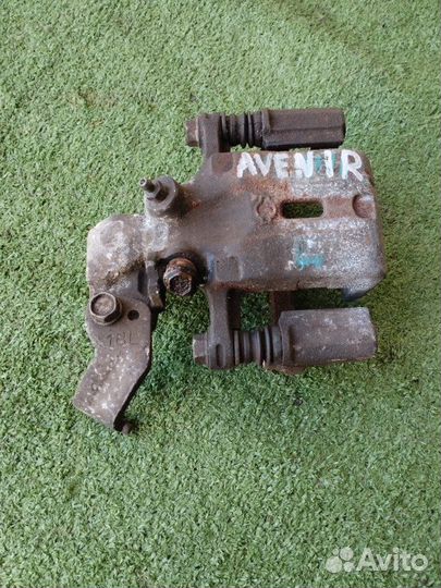 Суппорт задний левый Nissan Avenir PW11 SR20DE