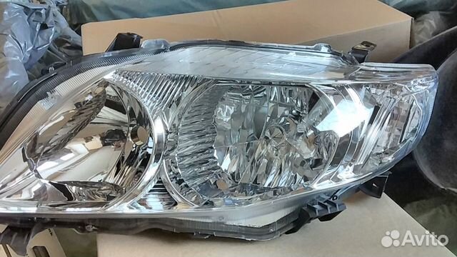 Фара левая Toyota Corolla E150 07-10