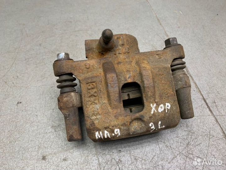 Тормозной суппорт задний левый Mitsubishi Lancer 9