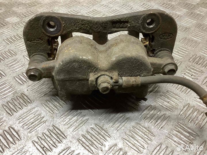 Суппорт передний правый Kia Carnival