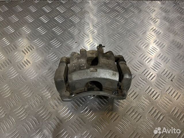 Суппорт тормозной передний левый Kia Rio 3