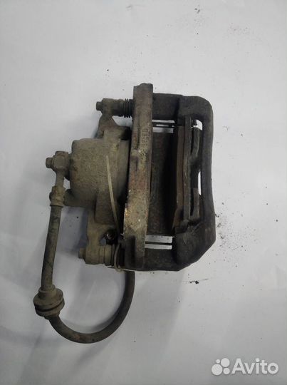 Суппорт тормозной левый передний Opel Astra j