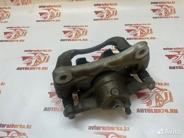 Суппорт тормозной передний левый Mazda 3 BM