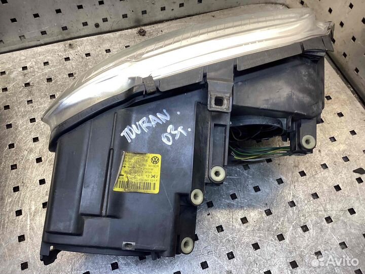Фара левая Volkswagen Touran