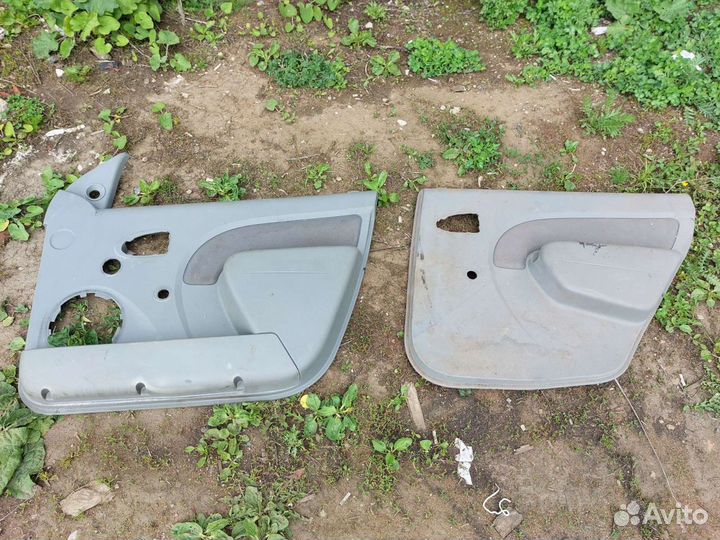 Обшивка двери renault logan