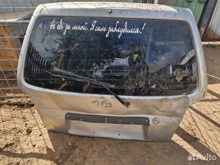 Стекло задней двери demio