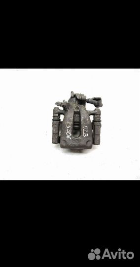 Суппорт тормозной задний левый Opel Zafira