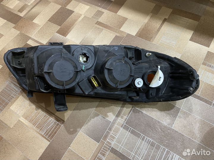 Фара левая Nissan Almera