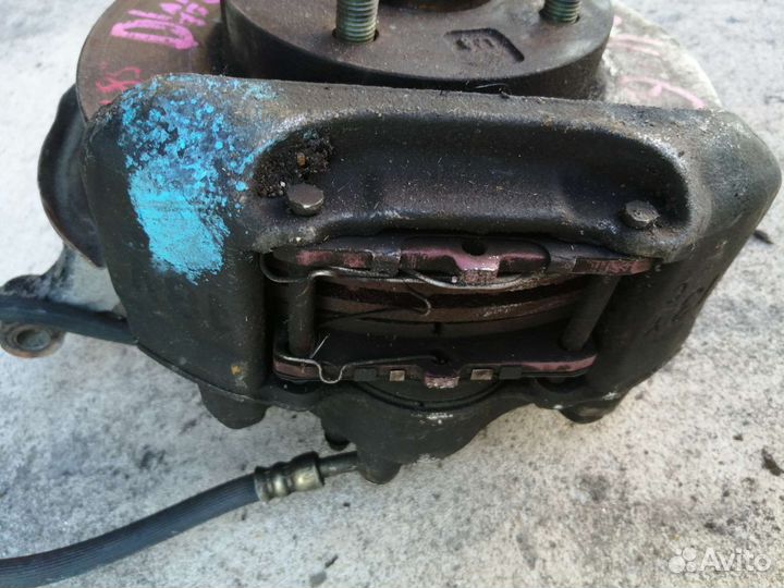 Мазда демио ступицасABS левая в сборе с суппортом