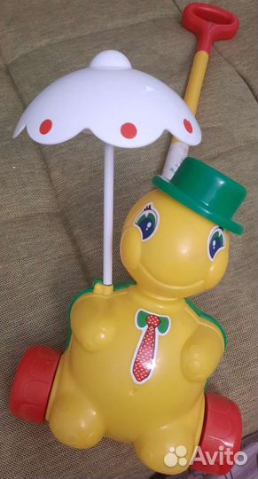 Игрушка каталка с ручкой