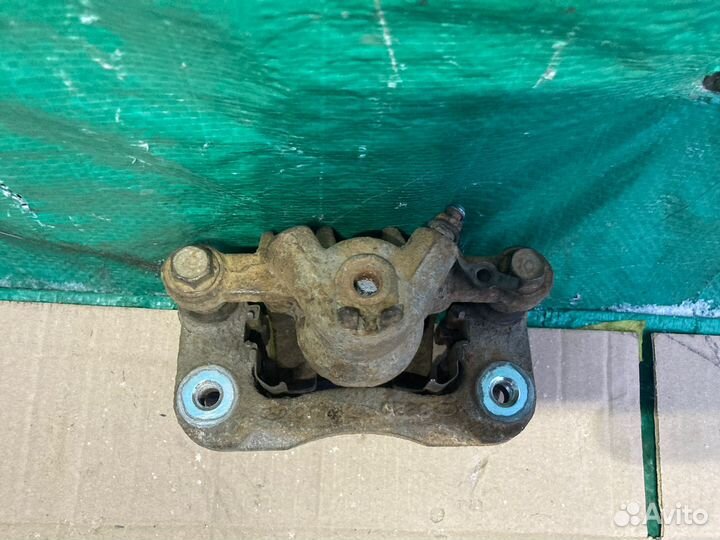 Суппорт тормозной задний левый Kia Cerato 09-2013Г