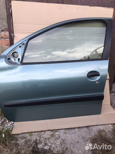 Дверь передняя левая Peugeot 206