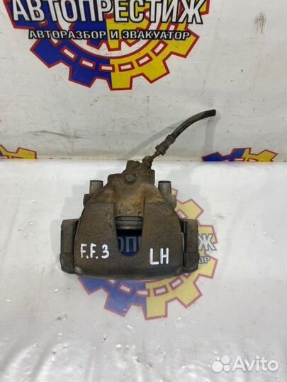 Суппорт тормозной передний левый Ford Focus 3 iqdb