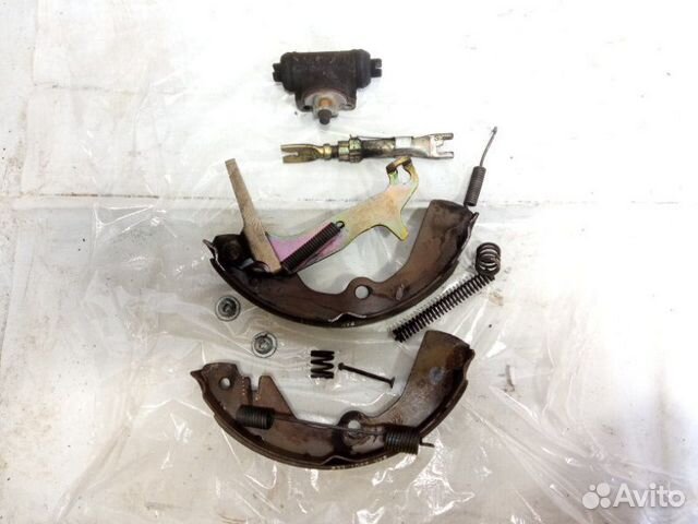 Механизм стояночного тормоза задний левый Nissan