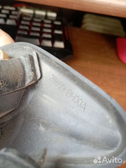 Форсунка омывателя фар левая Nissan Tiida