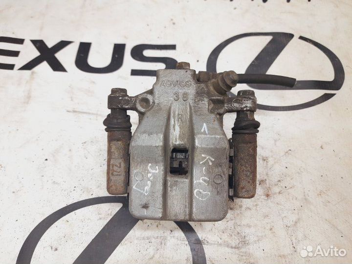 Суппорт тормозной задний правый Toyota Camry ACV40