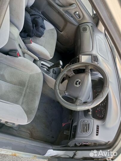 Mazda Familia 1.3 AT, 1999, 100 000 км