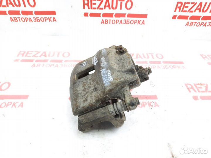 Суппорт тормозной передний правый Nissan Primera