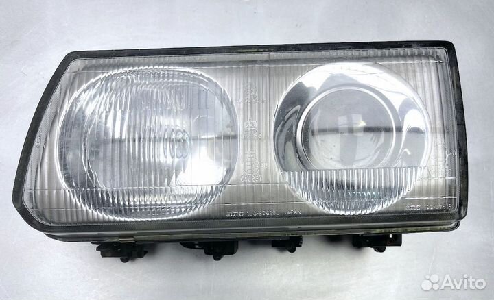 Мицубиси L300 Фара передняя Лев