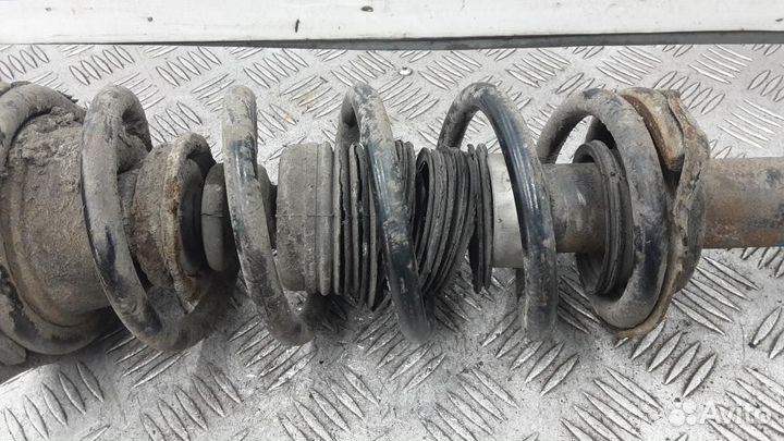 Стойка амортизатора заднего левого Nissan Almera