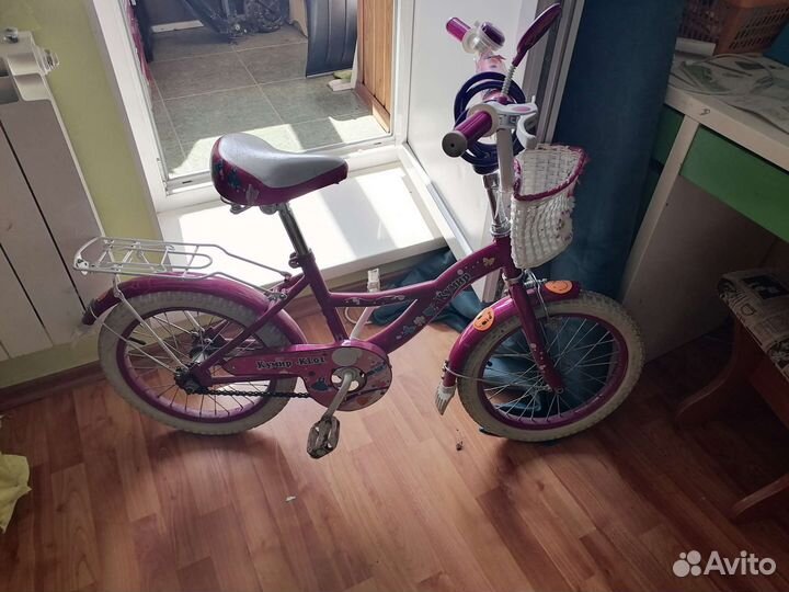 Продам детский велосипед с боковыми колесами