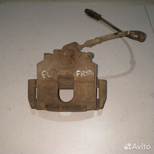 Суппорт тормозной передний левый Ford Fiesta
