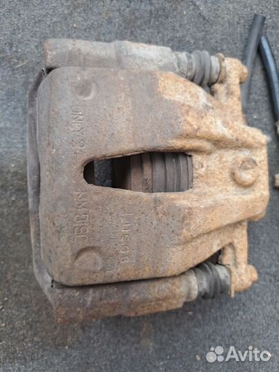 Суппорт тормозной передний Opel Corsa C