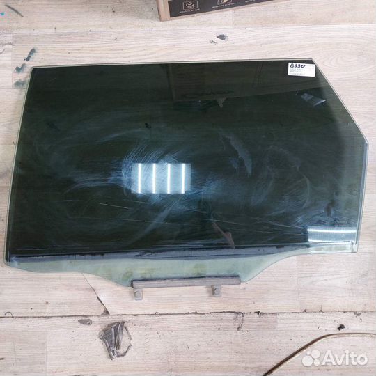 Тойота Калдина стекло двери заднее левое