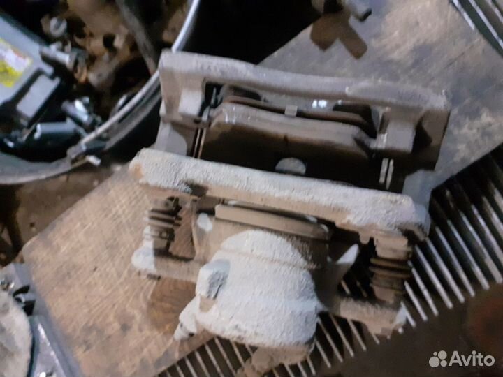 Суппорт тормозной Nissan Almera (G15)