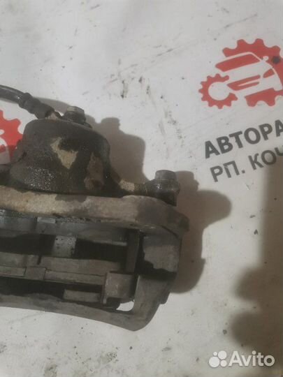 Суппорт тормозной передний левый Mitsubishi Libero