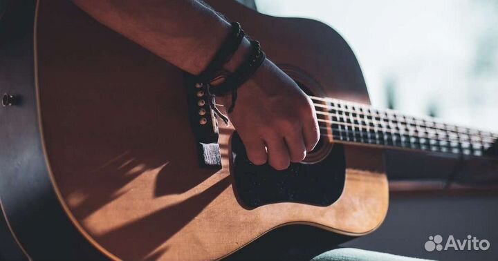 Преподаватель игры на гитаре