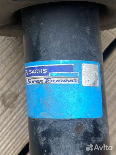 Стойка амортизатора передняя левая в сборе