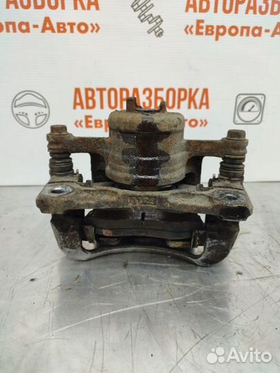 Суппорт тормозной передний левый Chevrolet Aveo