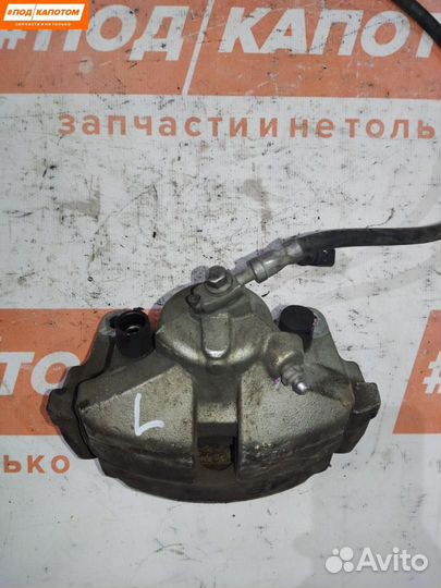 Суппорт тормозной передний левый Volkswagen Caddy