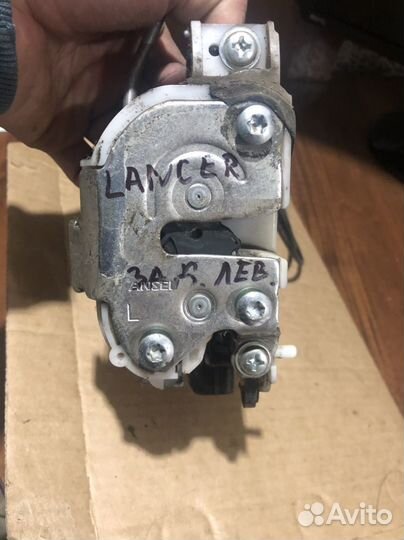 Замок двери задний левый Lancer 10