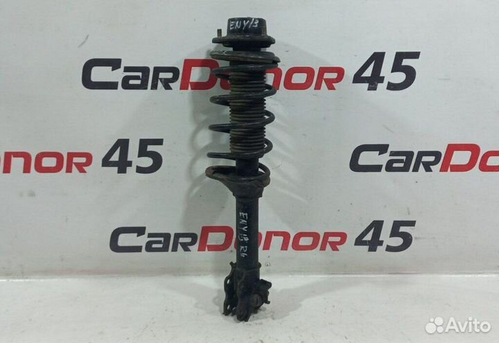 Амортизатор в сборе задний левый б/у для Nissan Bl