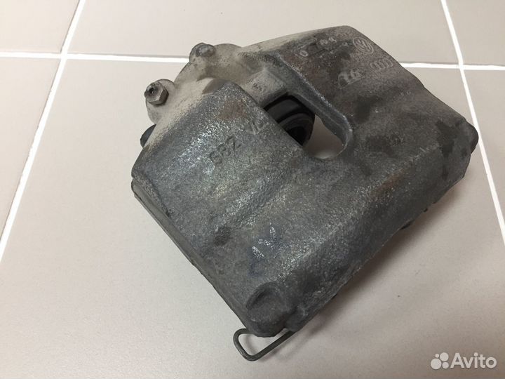 Суппорт тормозной передний правый VAG 1K0615124E