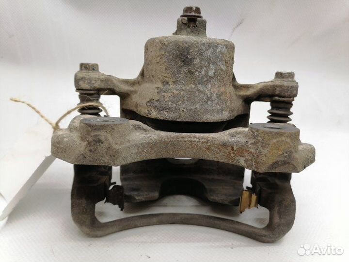 Суппорт тормозной передний левый Nissan Maxima A32