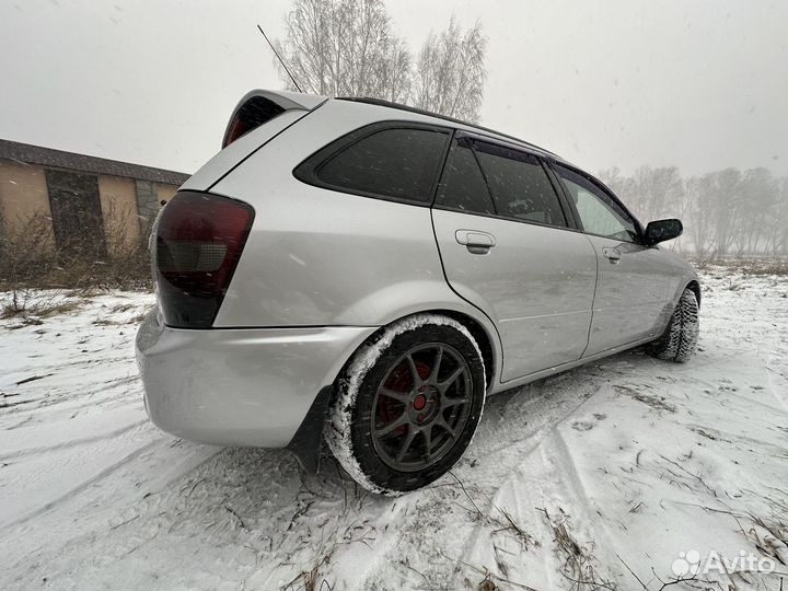 Mazda Familia 1.8 AT, 1999, 260 000 км