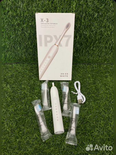 Электрическая зубная щетка