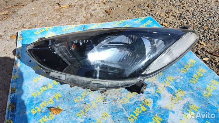 Фара левая Mazda Demio DE3FS